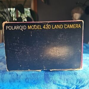 Polaroid Box with Navy Blue and Yellow Lettering